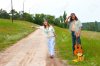 20961742-couple-hitchhiker-hippie-with-guitar-on-the-road-Stock-Photo.jpg