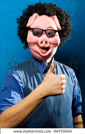 stock-photo-close-up-portrait-of-a-man-wearing-a-pig-mask-both-funny-and-spooky-86950606.jpg